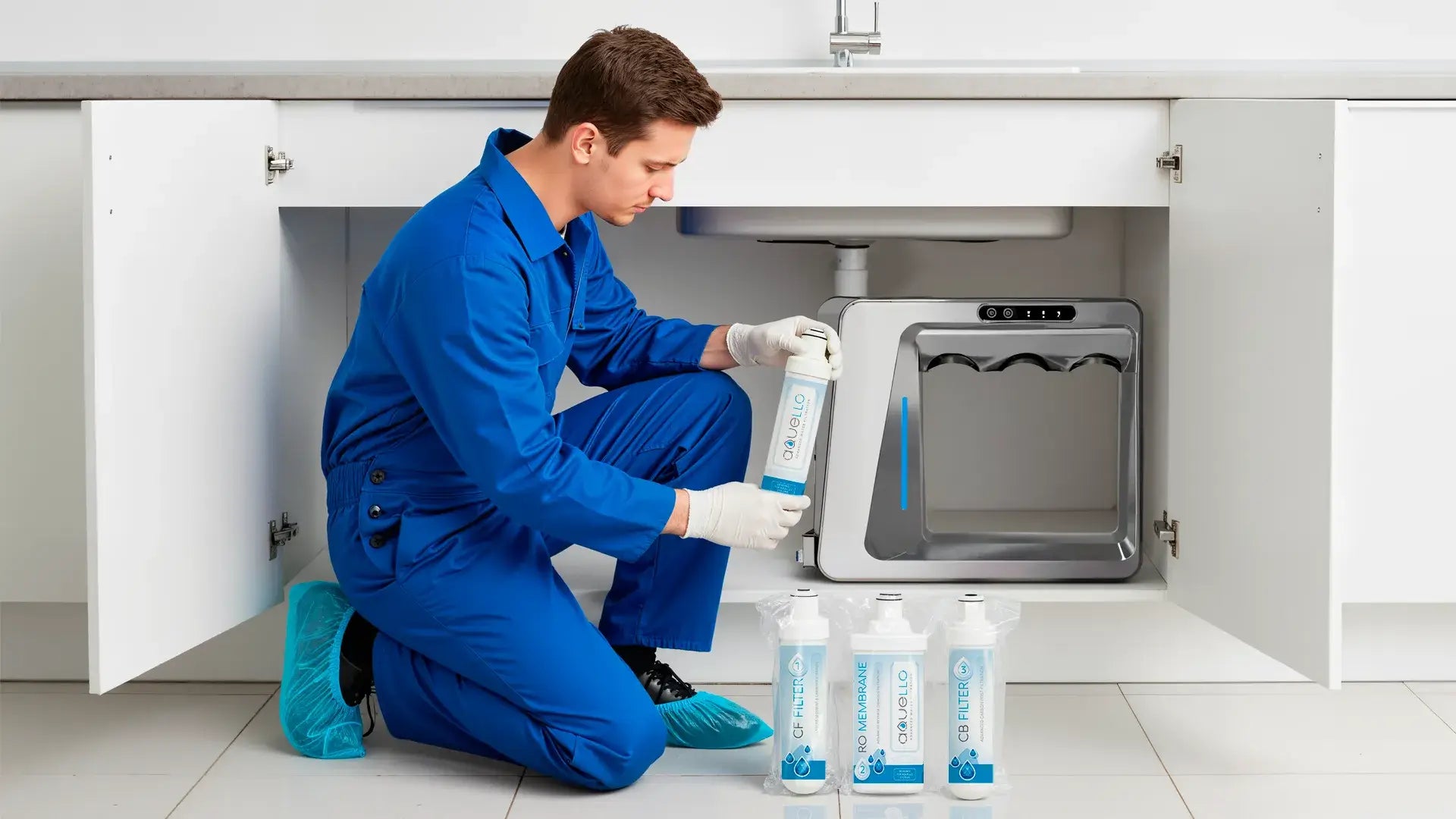 Plumber connecting purification filters to an under-sink RO System in a kitchen.